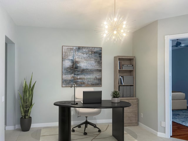 office with light tile patterned floors and an inviting chandelier