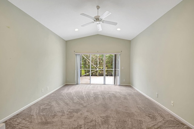 spare room featuring lofted ceiling, ceiling fan, and carpet floors