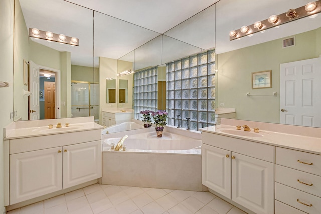 bathroom with vanity, separate shower and tub, and tile patterned flooring