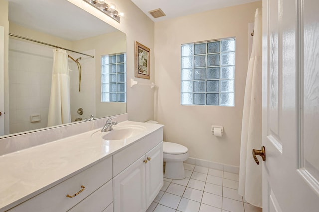 bathroom with toilet, vanity, tile patterned flooring, and a shower with shower curtain