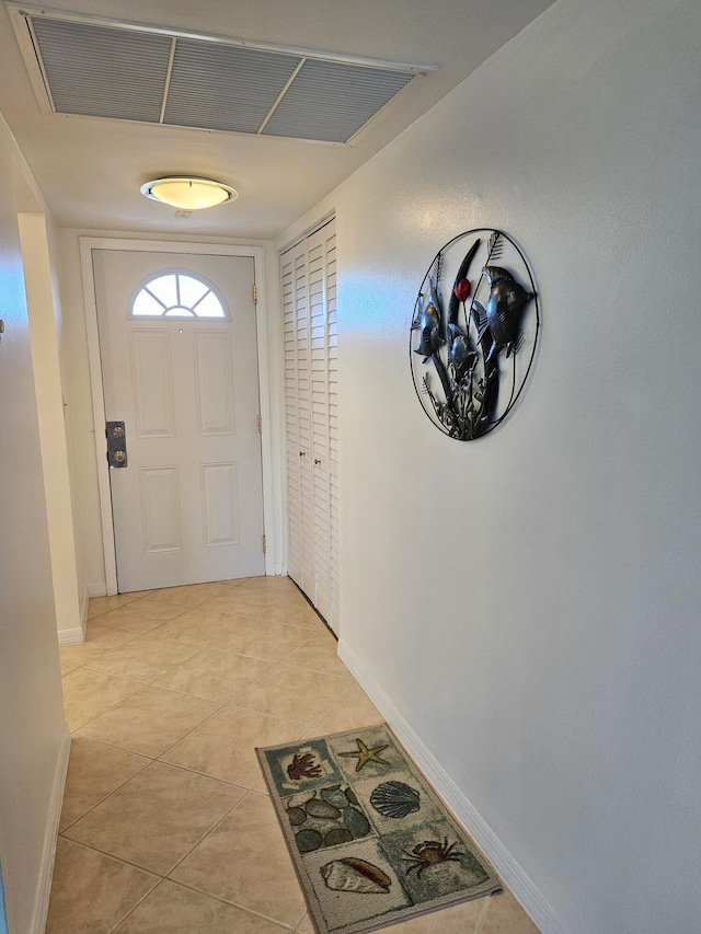 doorway to outside featuring light tile patterned floors