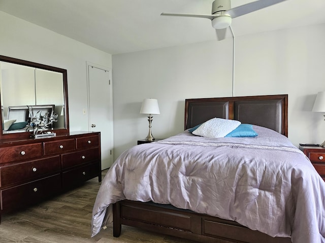 bedroom with hardwood / wood-style flooring and ceiling fan