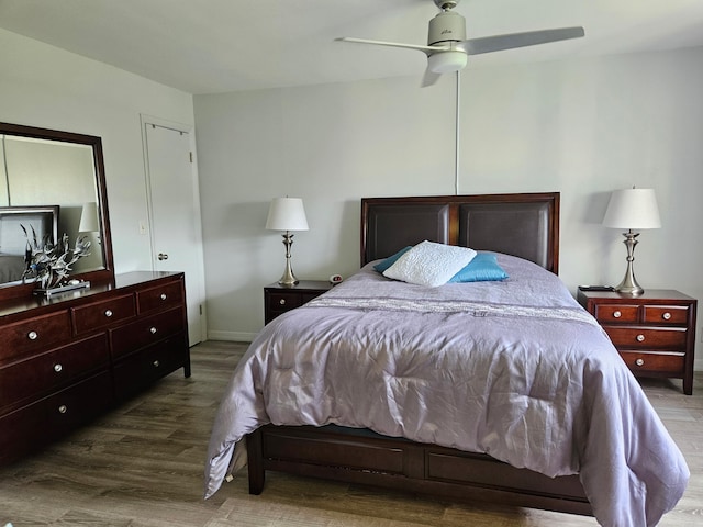 bedroom with ceiling fan and hardwood / wood-style floors