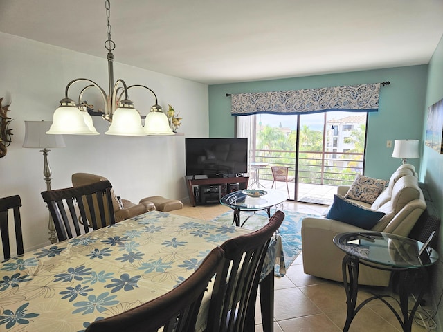 tiled dining space with a notable chandelier