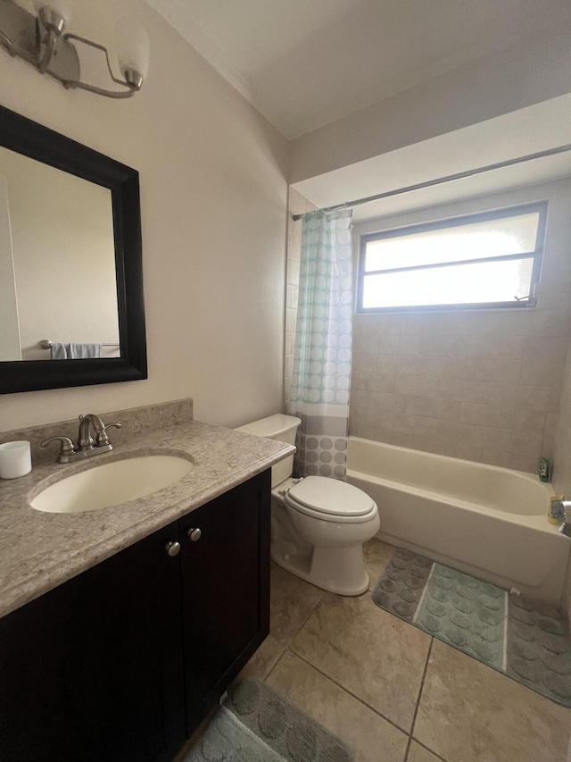 full bathroom with toilet, vanity, tile patterned floors, and shower / tub combo with curtain