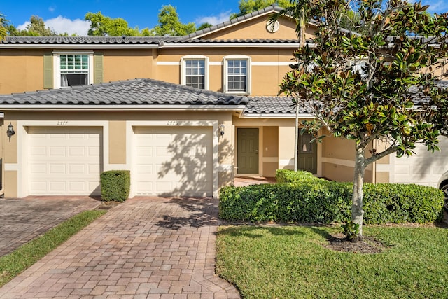 view of front of property with a garage