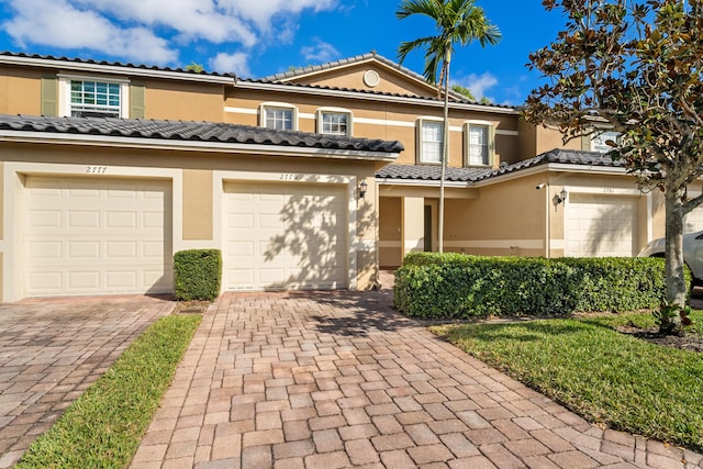 mediterranean / spanish-style house featuring a garage