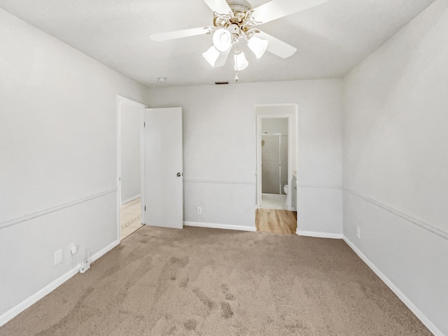 unfurnished room featuring ceiling fan and light colored carpet