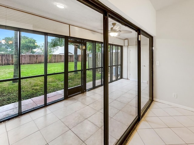 entryway featuring ceiling fan and light tile patterned floors