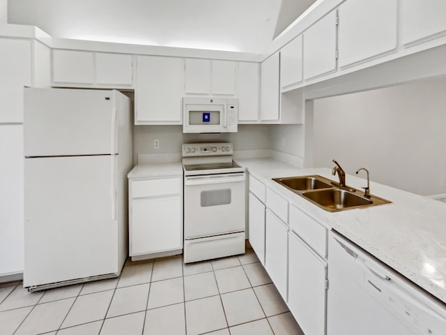 kitchen with sink, white appliances, white cabinetry, and light tile patterned floors