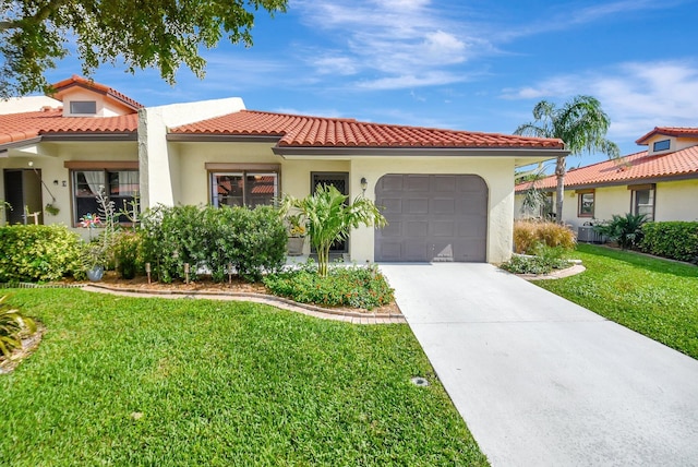 mediterranean / spanish-style house featuring a front yard and a garage