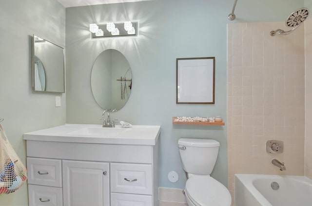 full bathroom with vanity, tiled shower / bath combo, and toilet