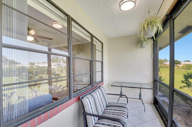 sunroom / solarium with ceiling fan