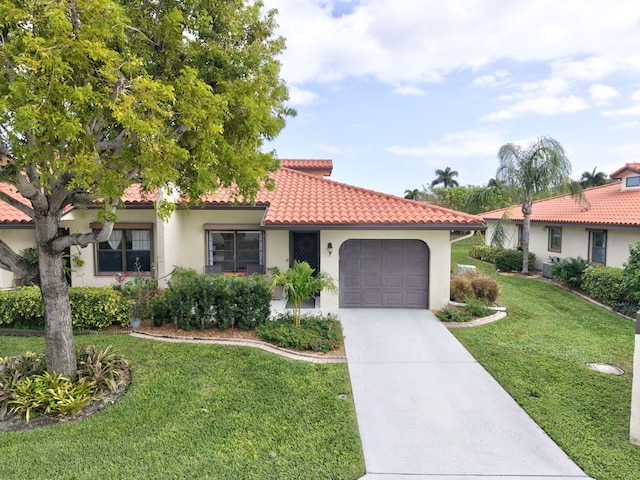 view of front facade featuring a front lawn and a garage