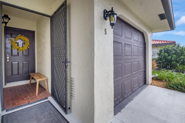 entrance to property featuring a garage