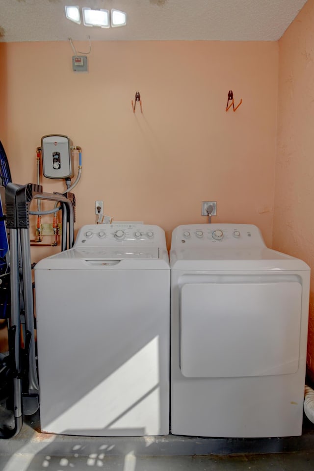 laundry area with washing machine and clothes dryer