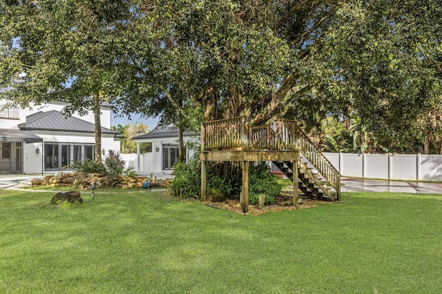 view of yard featuring a wooden deck