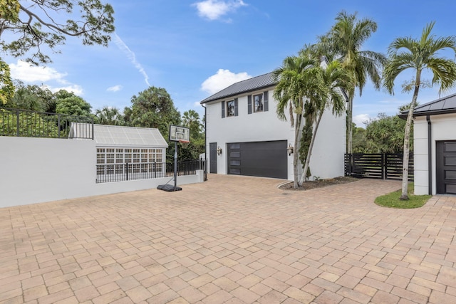 view of property exterior featuring a garage