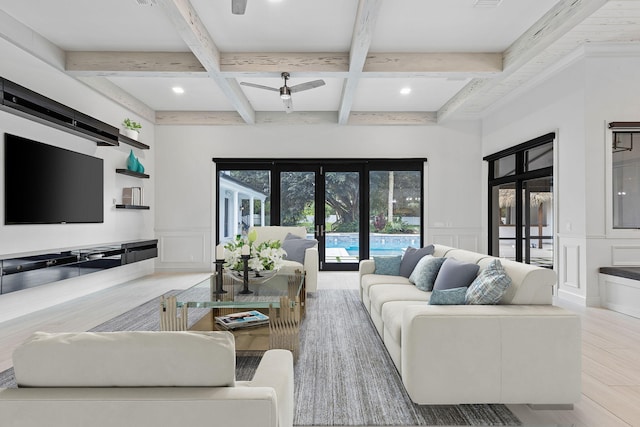 living room with coffered ceiling, wood-type flooring, beam ceiling, and french doors