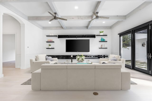 living room featuring beam ceiling, ceiling fan, coffered ceiling, and light hardwood / wood-style floors