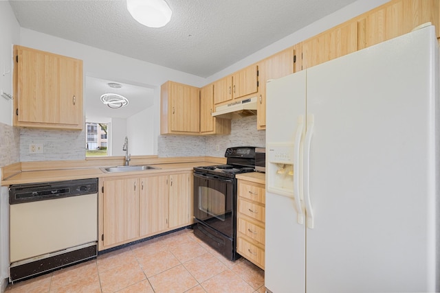 kitchen with sink, light brown cabinets, a textured ceiling, white appliances, and light tile patterned floors