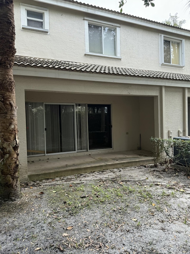 rear view of house featuring a patio area