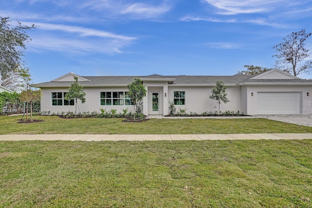 ranch-style house featuring a front yard and a garage