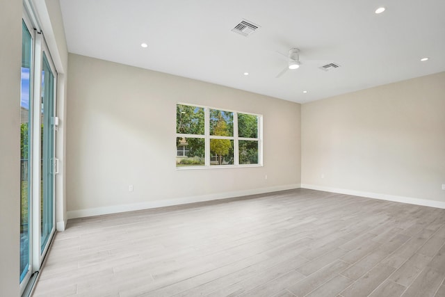 spare room with ceiling fan and light hardwood / wood-style flooring