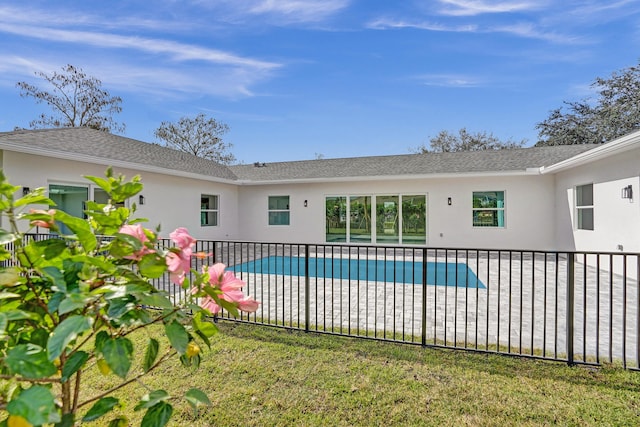 view of swimming pool featuring a patio area and a lawn