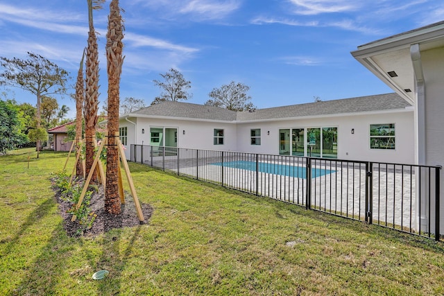 view of pool with a lawn and a patio area