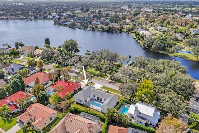 birds eye view of property featuring a water view