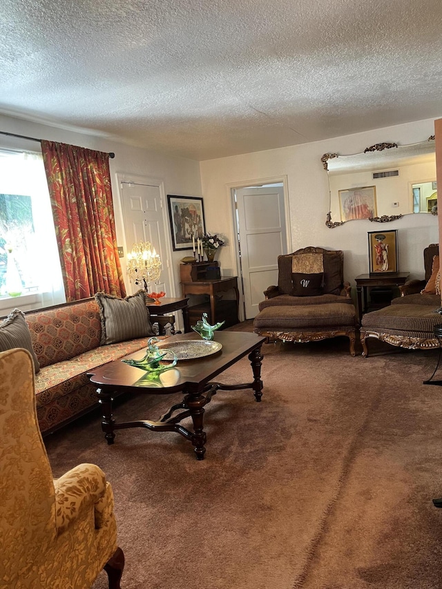 living room with carpet and a textured ceiling