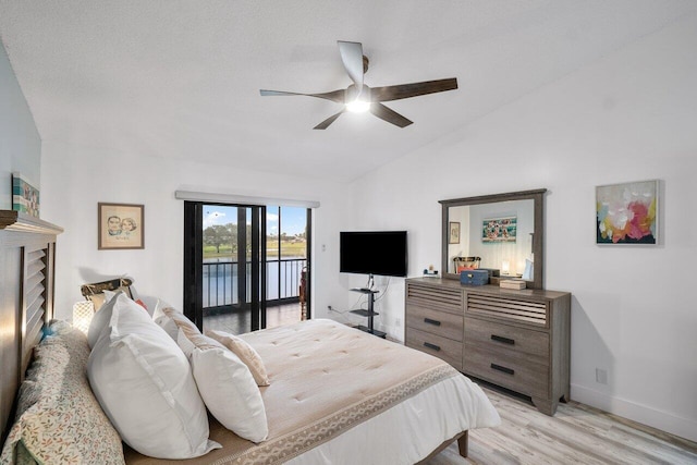 bedroom featuring a textured ceiling, lofted ceiling, access to outside, ceiling fan, and light hardwood / wood-style flooring