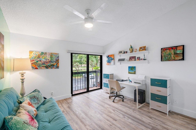 office space with light hardwood / wood-style floors, a textured ceiling, and ceiling fan