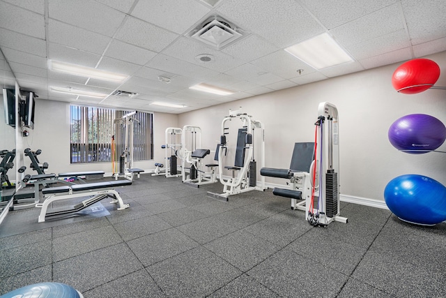 exercise room featuring a paneled ceiling