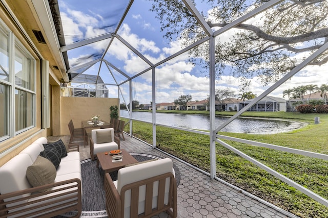 sunroom / solarium with a water view