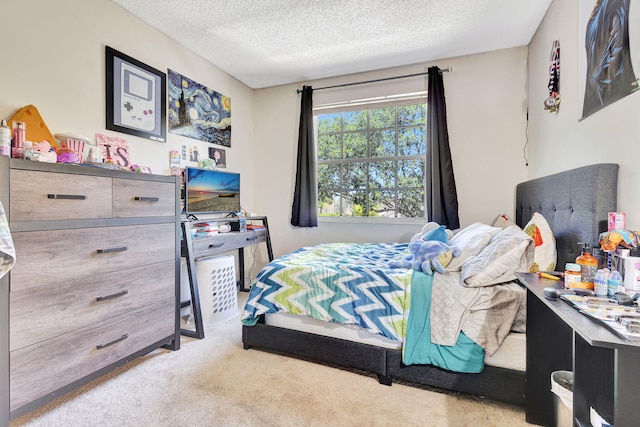 bedroom featuring light colored carpet and a textured ceiling