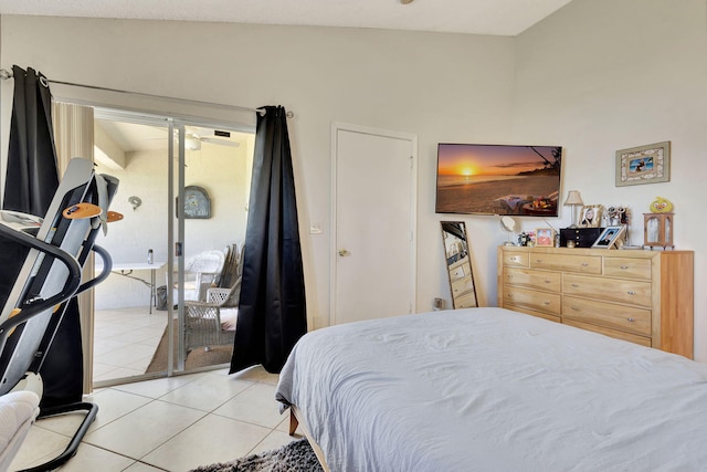 tiled bedroom featuring access to exterior and lofted ceiling