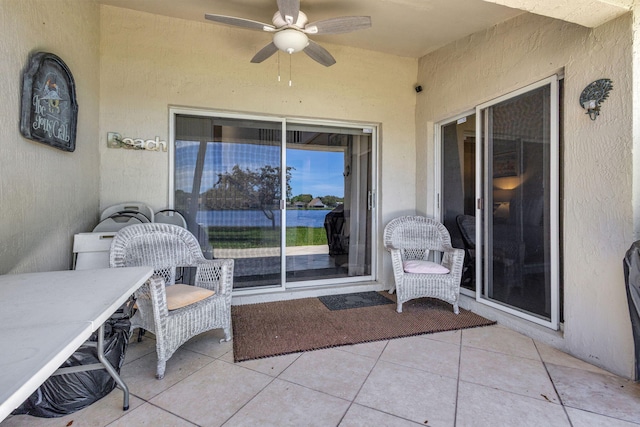 view of patio featuring ceiling fan