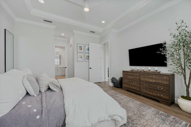 bedroom with ceiling fan, ensuite bathroom, ornamental molding, and hardwood / wood-style flooring