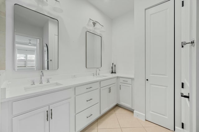 bathroom featuring ceiling fan, tile patterned flooring, and vanity