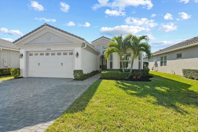 single story home with a front lawn and a garage