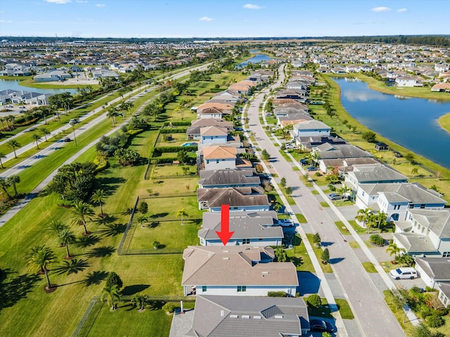 birds eye view of property featuring a water view