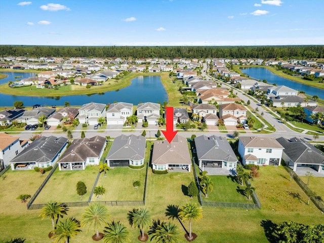 birds eye view of property featuring a water view