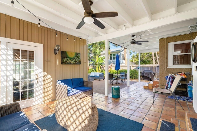 view of patio with outdoor lounge area, ceiling fan, and a grill