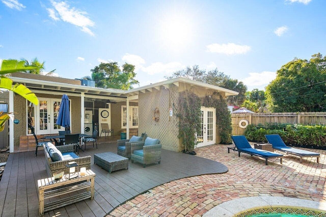 back of property featuring french doors, an outdoor hangout area, and a wooden deck