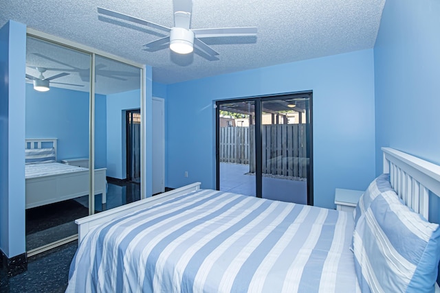 bedroom with a textured ceiling and ceiling fan