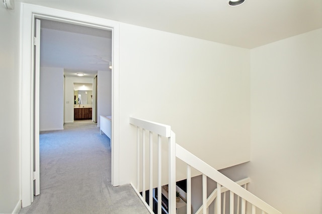 corridor with light colored carpet