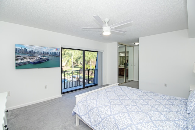 carpeted bedroom with access to exterior, a textured ceiling, and ceiling fan