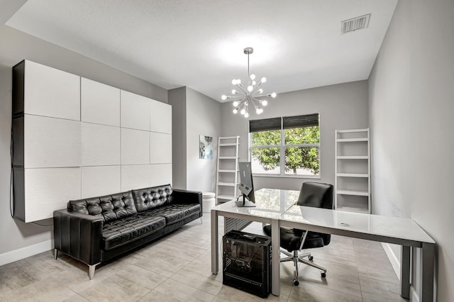 home office featuring an inviting chandelier